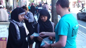 Street-level distribution of drug education booklets reaches both youth and adults along London thoroughfares.